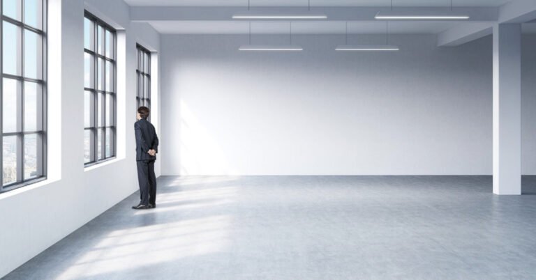 office leasing strategy featured banner image, guy in empty office space