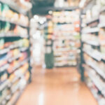 cpg accounting and finance questions banner image, blurred grocery aisle
