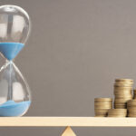 stages of effective cost savings initiatives balanced scale with coins and hourglass